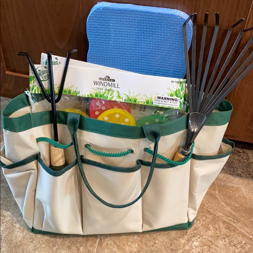 New Gardening bag with items. Cultivator & rack.